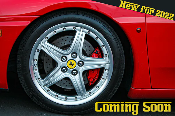 The wheel of a Ferrari sports car. Motorsport photography by Jeffrey Meyer.