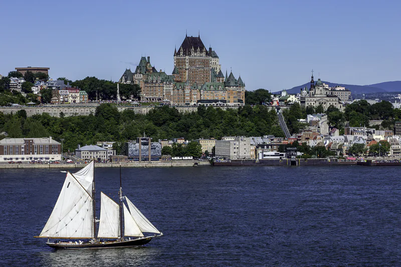 The Bluenose II sails down the St. Laurance, and past le Château Frontenac, in Québec City. Fine art prints and licenses by Jeffrey Meyer.