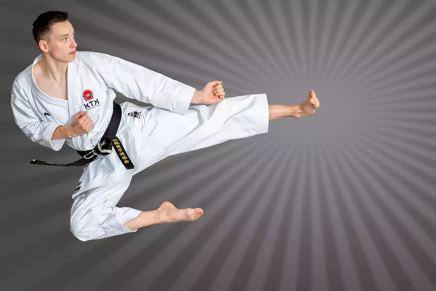 KTK Martial Arts sensei performing a flying kick.  Sport photography by Jeffrey Meyer