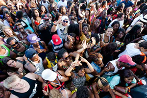A concert crowd jumps in the air with excitement.  Photo by Jeffrey Meyer.