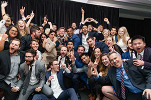 Dozens of people burst into team camaraderie celebration.  Photo by Jeffrey Meyer. 