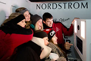 Six teenagers having a blast in a photobooth during an event activation for Nordstrom's Grand Opening in Ottawa.   Photo by Jeffrey Meyer