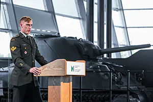 A Canadian soldier delivers a thank you speech for the fundraising performed to commemorate the fallen of WWII.   Photo by Jeffrey Meyer.