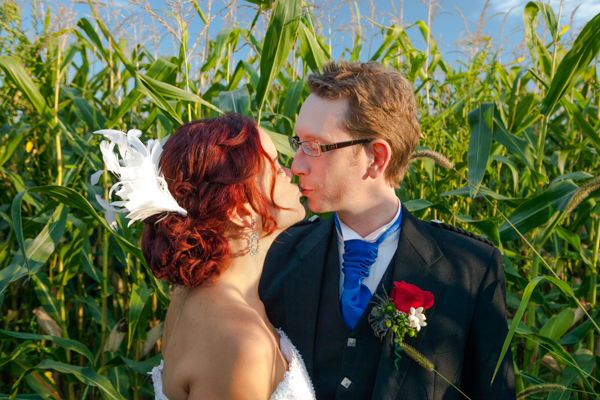Husband and wife kiss in a core field