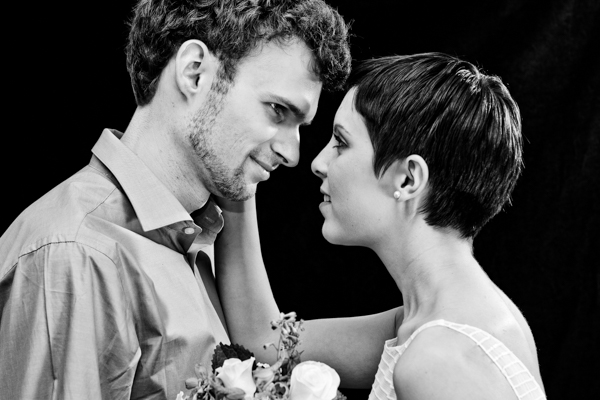 A bride and groom pose in my home studio