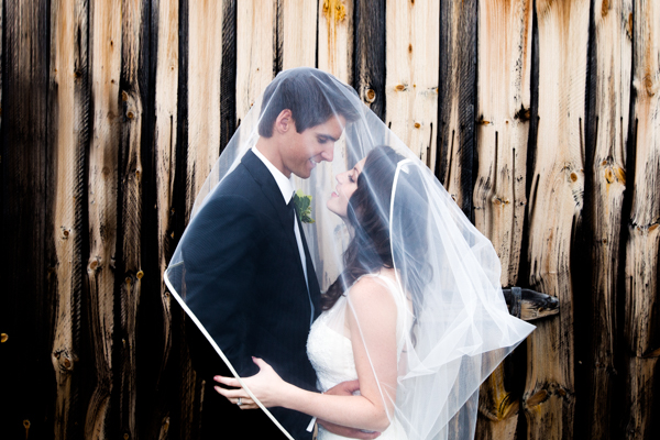 wedding portraits next to rustic barnwood
