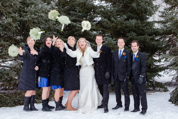 Wedding party celebrates in the cold snow